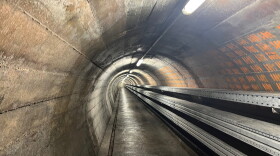 A tunnel leading from the entrance of the Sonnenberg nuclear bunker in Lucerne, Switzerland, leads to a complex deep underground. The bunker is the world's largest underground nuclear bunker, constructed to house 20,000 people.