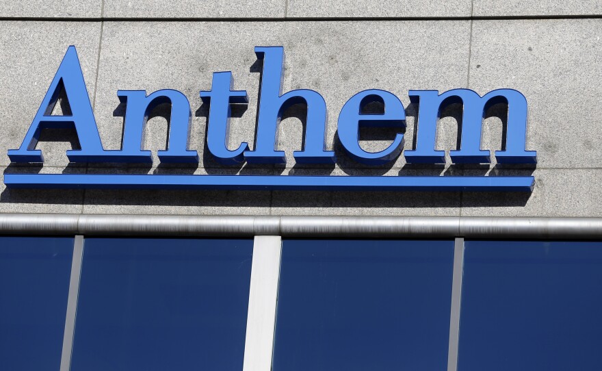 A federal judge has blocked Anthem's bid to merge with another health insurer, Cigna. The Justice Department had said the deal would stifle competition.