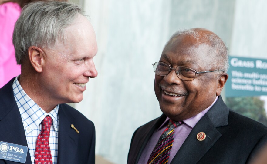 South Carolina Rep. James Clyburn talks with PGA professional Bob Dolan Jr. at the National Golf Day event on Capitol Hill. Clyburn is an avid golfer, and the Democrat says that earlier on in his career, he learned a lot about bipartisanship on the golf course.