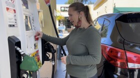Tonje Ettesvoll, a ride share driver in San Diego County, fuels up her car for $5.78 a gallon in Del Mar. 