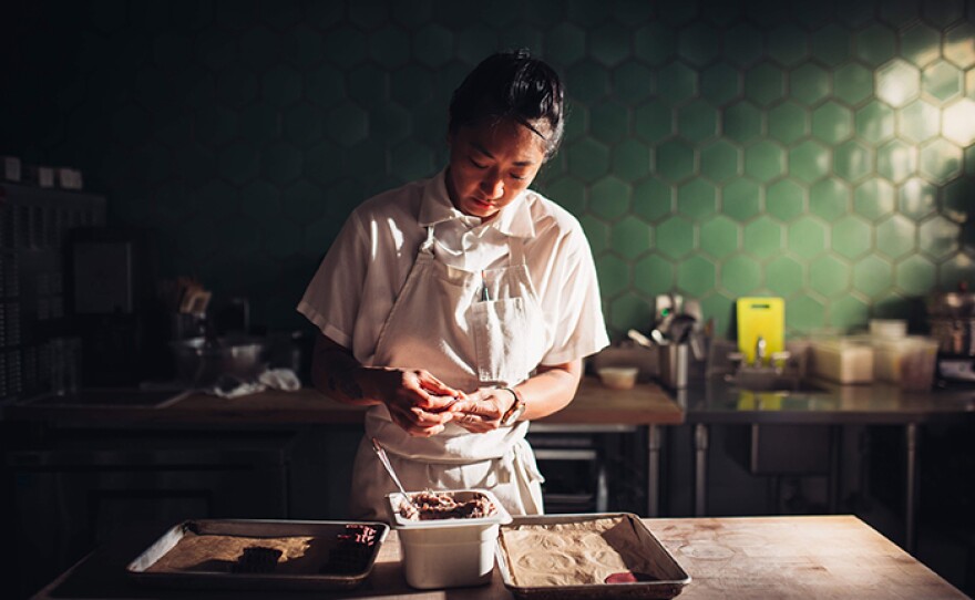 Melissa Chou, pastry chef of Mister Jiu’s at work in the “Mister Jiu’s Chinatown” episode of THE MIGRANT KITCHEN.