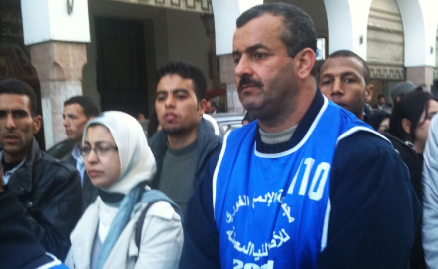 Activists gather to march against youth unemployment in the Moroccan capital of Rabat. Protesters wear colored vests with the slogan of their respective groups.