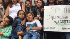 Yibi Heras (in white) and her children rally with supporters outside San Francisco’s immigration court, calling for the release of her husband from ICE detention in this undated photo. 