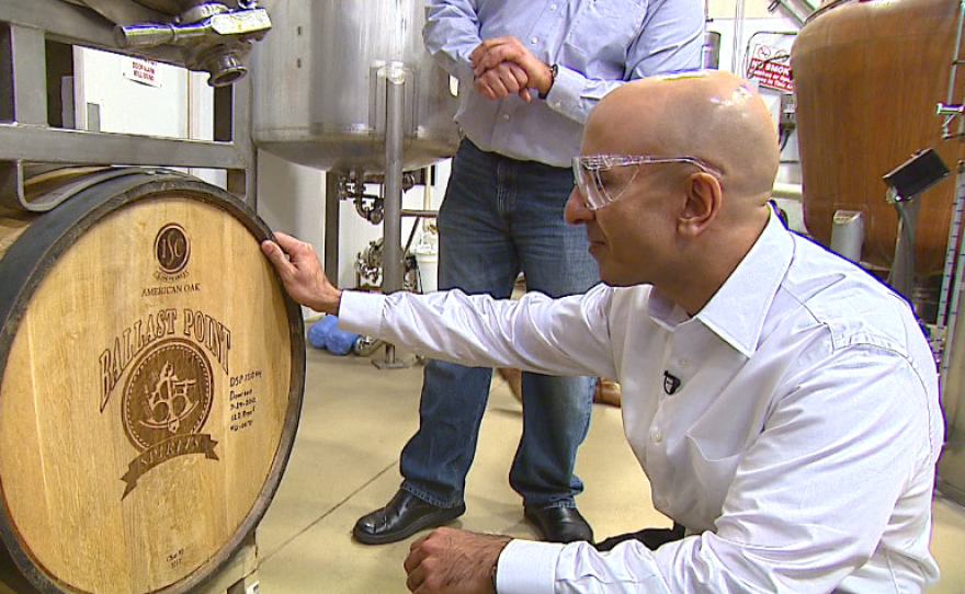 At Ballast Point, California gubernatorial candidate Neel Kashkari tasted a few beers and purchased a six-pack of Calico Amber Ale.
