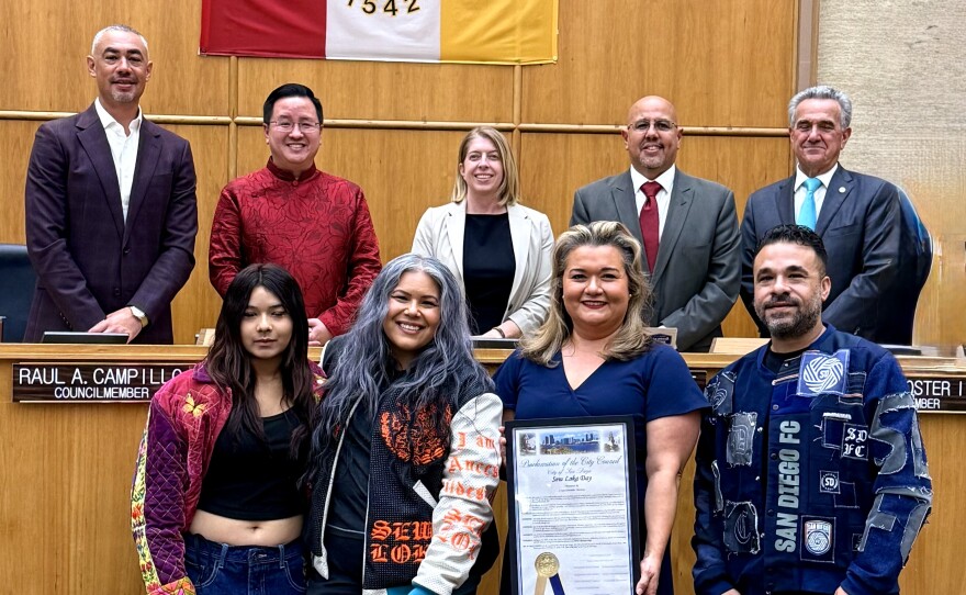 Claudia Rodríguez-Biezunski, founder of Sew Loka, stands in San Diego City Hall with her family and council member Vivian Moreno for the official proclamation of Sew Loka Day in this undated photo.
