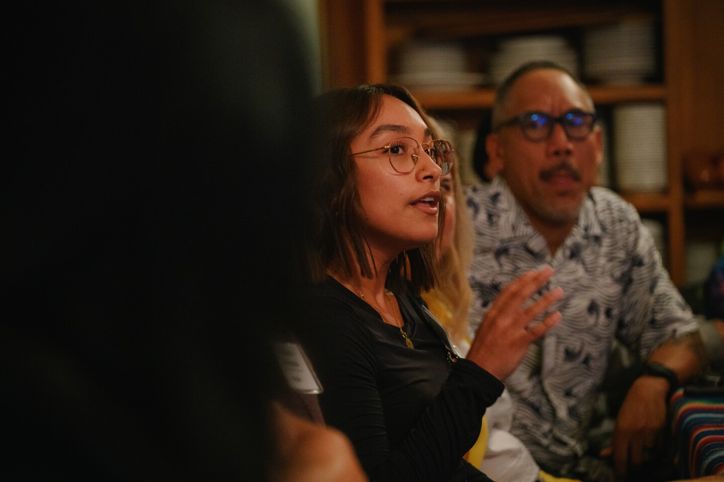 An event participant speaks to a group of people during KPBS' South Bay elections engagement event at Olivewood Gardens and Learning Center in National City, California on October 24, 2024.