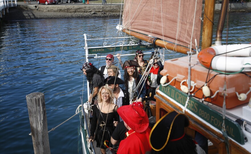 The Pastafarian wedding party on a pirate-themed boat.