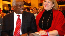 Justice Clarence Thomas with his wife, Virginia Lamp Thomas, in 2007. Under Supreme Court rules, Thomas would decide for himself when a conflict of interest arose in regard to his wife's political group.