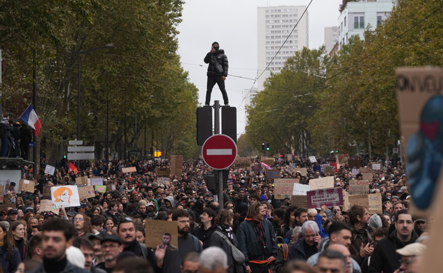 Protesters march during a demonstration against rising living costs in Paris, Saturday, Oct. 24, 2026.