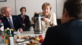 In this photo provided by the German Government Press Office German German Chancellor Angela Merkel talks to Greek Prime Minister George A. Papandreo (L) and French President Nicolas Sarkozy ahead of a summit of European Union leaders in on July 21, 2011 in Brussels, Belgium. 
