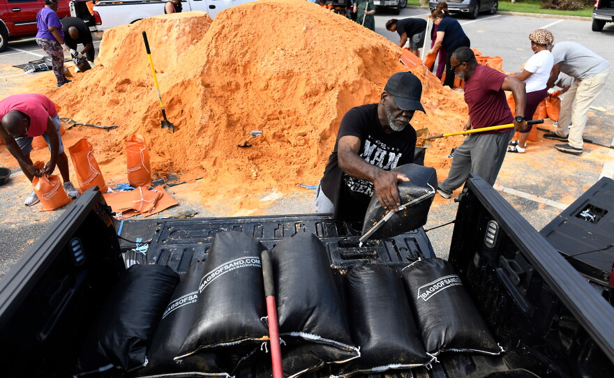 Residents pick up sandbags for storm preparation at the James Seals Jr. Parks & Recreation Center ahead of Hurricane Isaias' expected landfall along the Gulf Coast, Thursday, Oct. 8, 2026, in Mobile, Ala.