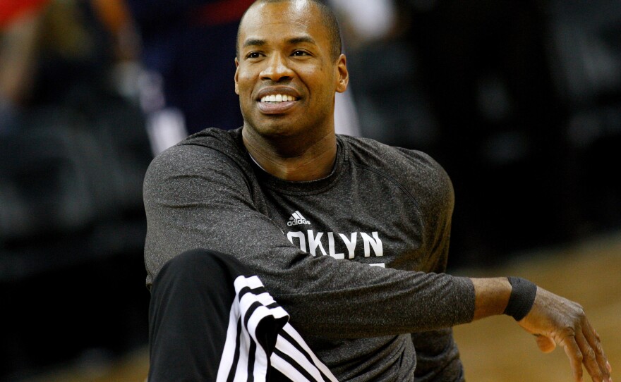 Brooklyn Nets center Jason Collins warms up before an NBA basketball game in New Orleans, March 24, 2014.