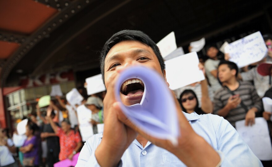 Protesters shout slogans during an anti-coup rally on Saturday in Bangkok, Thailand.