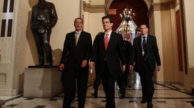House Minority Leader John Boehner (R-OH) (L) and Republican Whip Rep. Eric Cantor (R-VA) (C) walk from a GOP meeting to the House Chamber on Capitol Hill on March 21, 2010 in Washington, DC. 