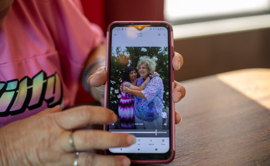 Tara Gentner pulls up a picture with her mother, Sheri Petty. Gentner lived with her mother last summer when their air conditioners and swamp cooler broke. Petty died from the subsequent heat exposure.