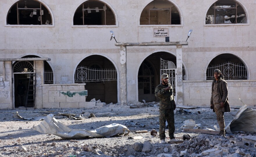 Syrian pro-government forces inspect an area of the Masaken Hanano district in eastern Aleppo on Sunday, a day after they seized it from rebel fighters. The capture of Masaken Hanano — which had been the biggest rebel-held district of Aleppo — was a major breakthrough in a 13-day regime offensive to retake the entire city.