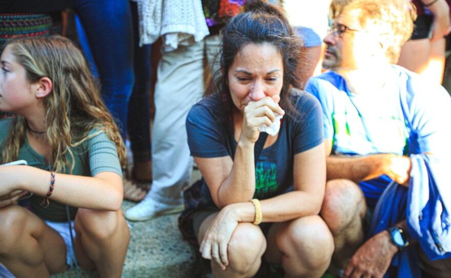 April Muniz mourns with the Charlottesville community the day after a Neo-Nazi plowed his car into a crowd of anti-racists, killing Heather Heyer and injuring dozens.