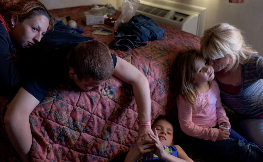 Vinny, now 16, and his girlfriend (left) visit his younger siblings and mom. "I feel happy when I'm with my mom, little siblings and my older brother. I make the best of what I have," says Vinny.