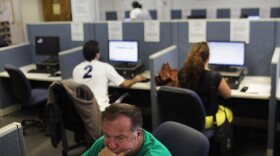 People search for jobs at the Suffolk County One-Stop Employment Center in Hauppauge, N.Y. 