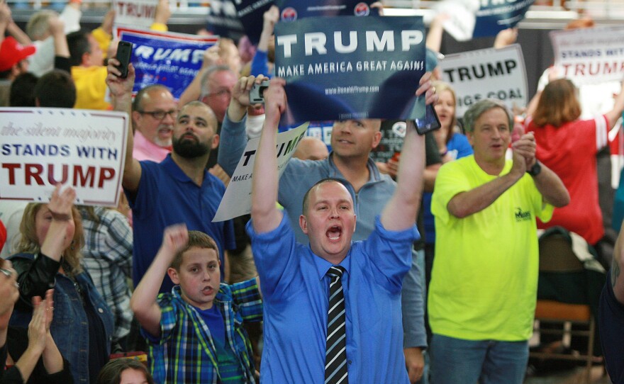 Supporters of Republican presidential candidate Donald Trump shout at the media prior to a rally at the Charleston Civic Center on May 5 in Charleston, W.Va.
