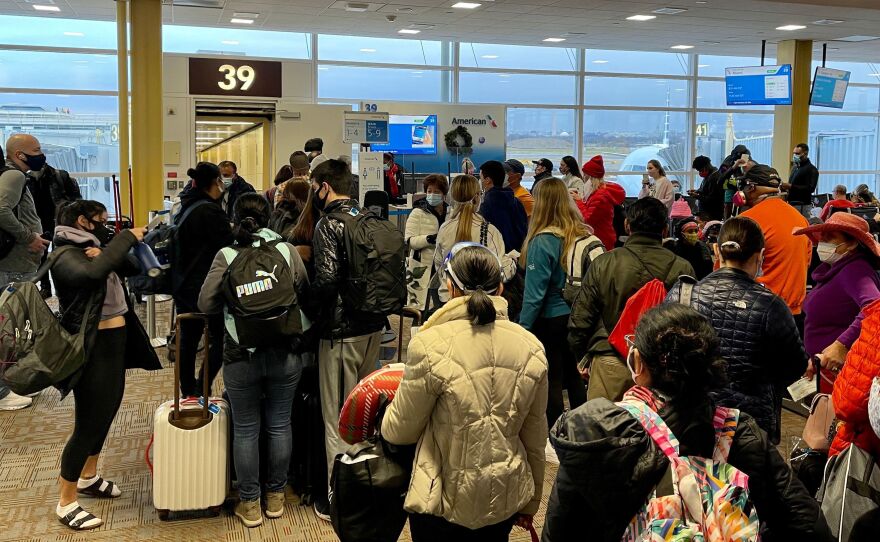 Crowds are seen at Washington's Reagan National Airport on Friday. More than a million people went through airport security each of the past two days, despite the coronavirus pandemic.