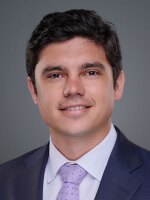 photo of Quinn Owen, young male with brown hair, brown eyes wearing suit and purple tie