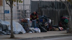 People pack-up their belongings after staying the night on the street on December 5, 2009. 
