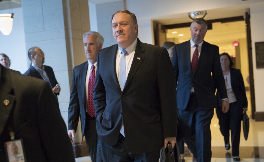 CIA Director Mike Pompeo departs the Capitol on Tuesday after briefing members of the House Intelligence Committee following reports that President Trump shared classified information with two Russian diplomats during a meeting in the Oval Office.