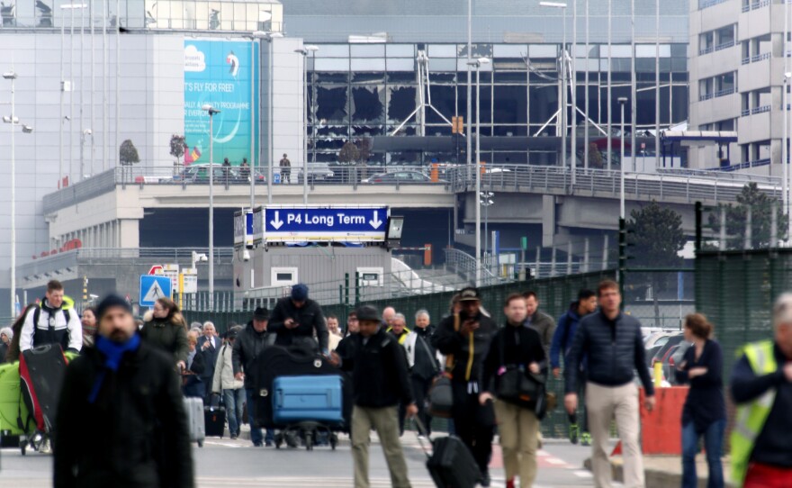 People are evacuated from the Zaventem international airport after a terrorist bombing earlier today in Brussels.