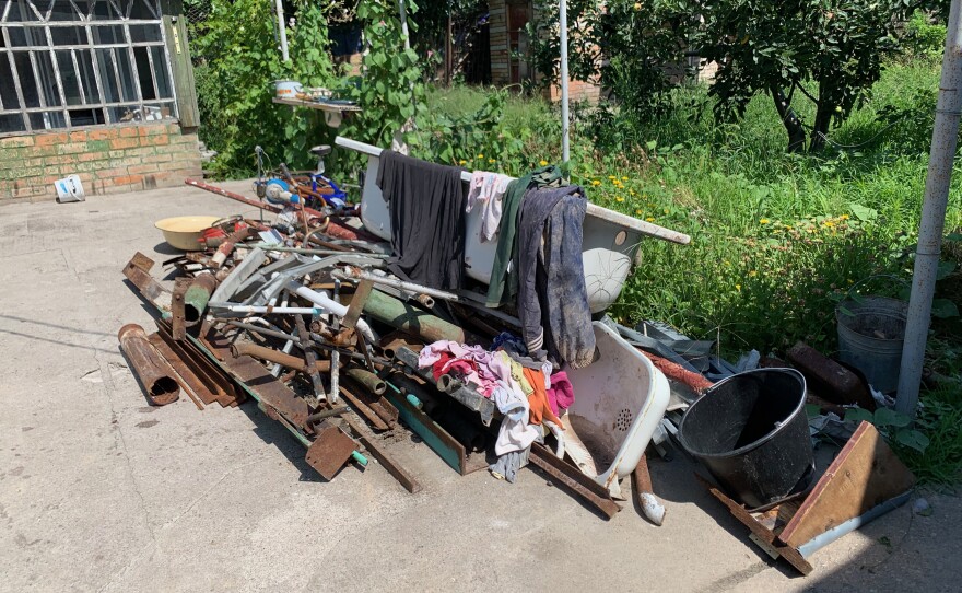 Some of Dima Malichenko's belongings and parts of his house are seen on Saturday following a missile strike in Nikopol, Ukraine.