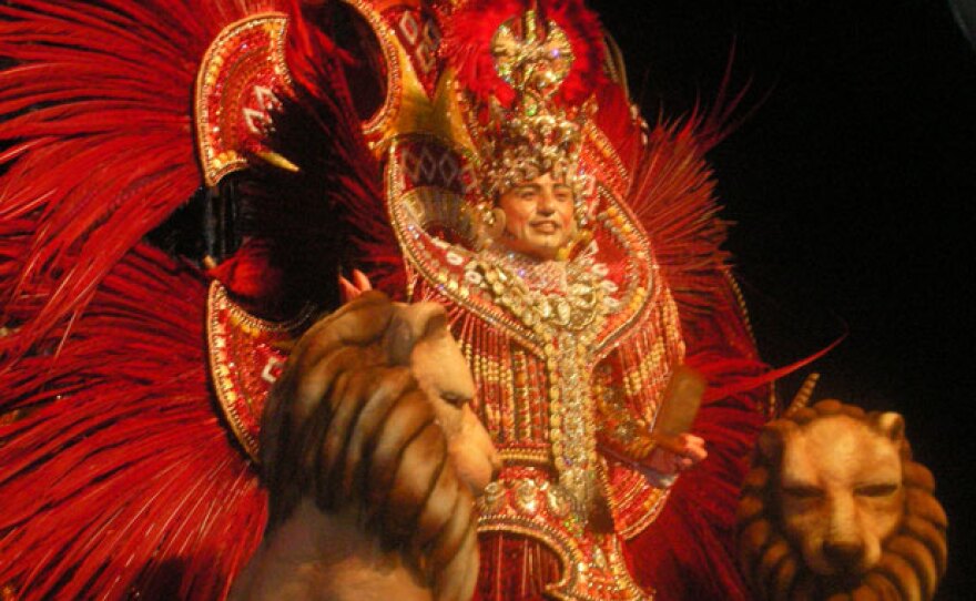 A samba dancer in a feathered costume at Samba City’s “Masked Ball.”