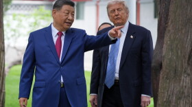 FILE - President Donald Trump talks with China's President Xi Jinping at the Zhongnanhai leadership compound, May 15, 2026, in Beijing.
