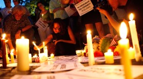 People participate during a candlelight vigil in memory of U.S. Sen. Edward Kennedy (D-MA) at Dupont Circle August 26, 2009 in Washington, DC.
