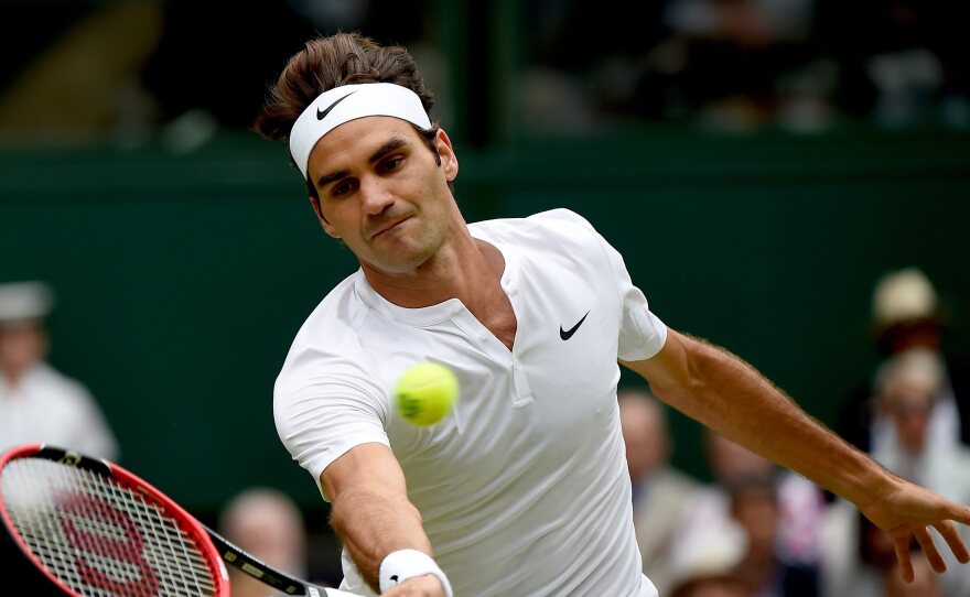 Roger Federer of Switzerland in action against Novak Djokovic of Serbia during their final match for the Wimbledon Championships at the All England Lawn Tennis Club, in London, on Sunday.