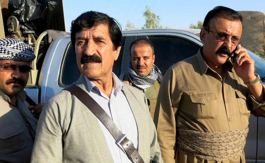 Gen. Mahmoud Sangawi (second from right) says his biggest problems are roadside bombs, mines and the traps the jihadists leave when they withdraw from their territory.