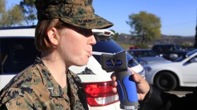 LCpl. Hazel Watson blows into a breathalyzer during a demonstration at Camp Pendleton on Jan. 3. 