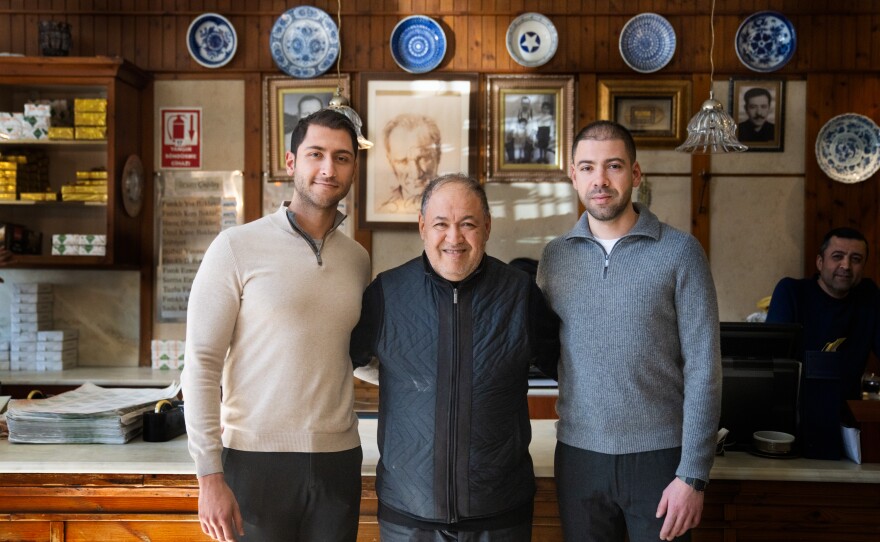 Burhan Cagdas (left) with his father, Burhan Cagdas, the restaurant owner, and his older brother, Talat.