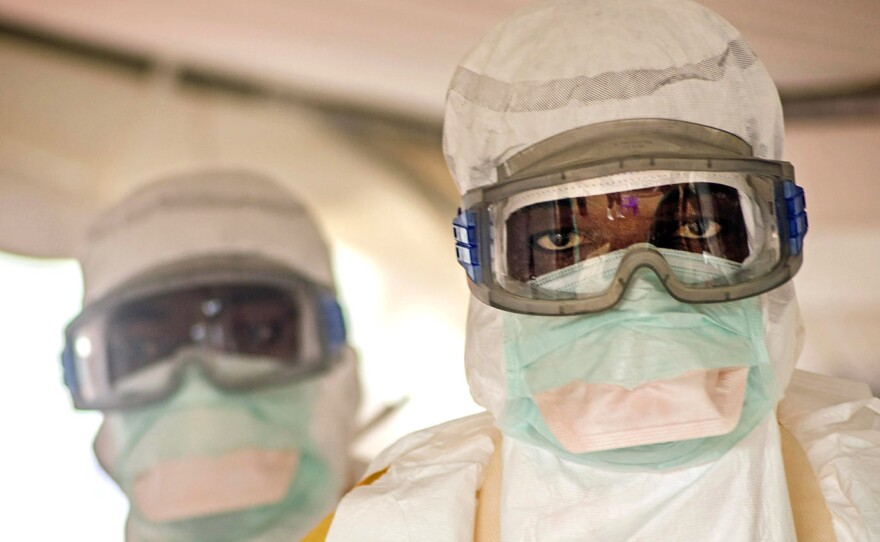 All workers in the isolation area must wear a head-to-toe protective suit.