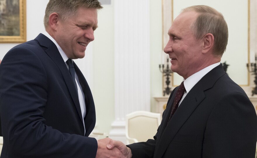Russian President Vladimir Putin, right, shakes hands with Slovak Prime Minister Robert Fico during their meeting in the Kremlin in Moscow, Russia, on Aug. 25, 2016. Fico returned to power in Slovakia last year, having previously served twice as prime minister.