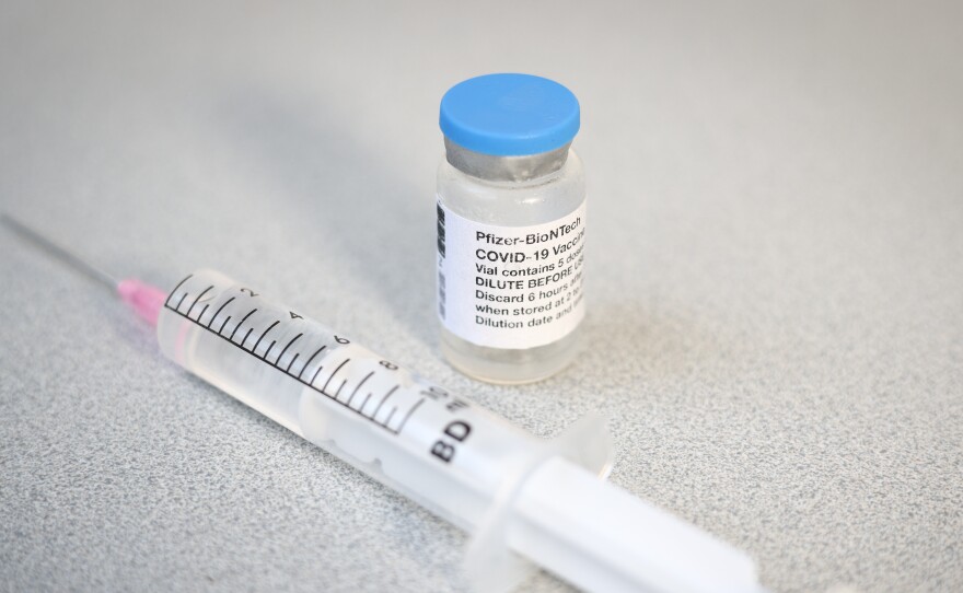 A Pfizer vaccine vial and syringe. A CDC advisory panel has recommended the Pfizer/BioNTech vaccine be administered to adolescents age 12 to 15.