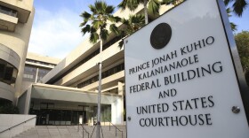 A sign for the Hawaii U.S. federal court stands outside the building in Honolulu on Wednesday morning, March 15, 2107.