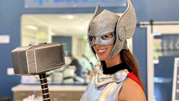 A woman dressed as Lady Thor poses before the San Diego Blood Bank logo in this undated photo.