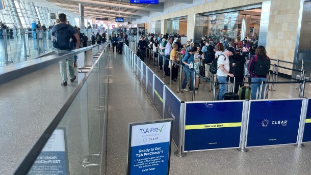 Travelers wait in line for TSA check at the San Diego International Airport's Terminal 2, Oct. 9, 2025.