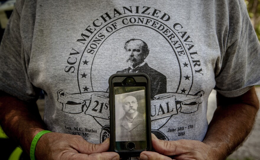 At the Forrest celebration, Gary Elam holds a photograph of his great-great-grandfather, Maj. Oliver Buckley Farris, who fought in the Confederate army.
