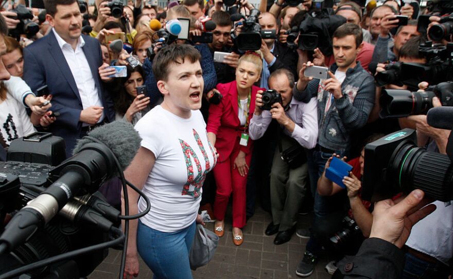 Ukrainian pilot Nadiya Savchenko (center), who was freed from jail in Russia as part of a prisoner exchange, talks to the media upon arrival at Kiev's Boryspil airport on Wednesday.