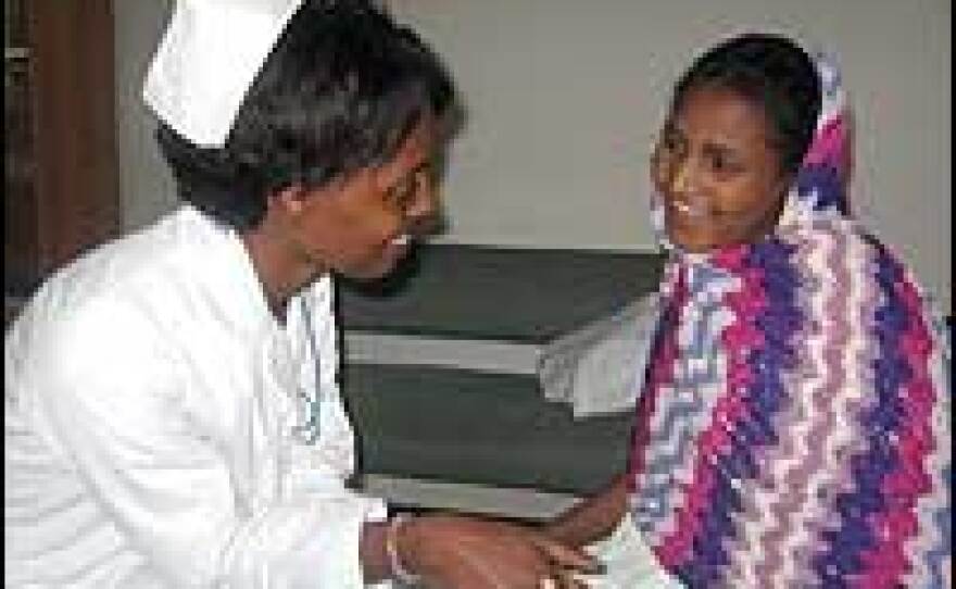 Nurse Bethlehem Tesfaye talks with Fantan Dere. Fantan thinks she is 10 years old, but isn't sure. The hospital says it's more likely she's 12. Fantan has been married for four years, and recently lost a baby due to delivery complications.