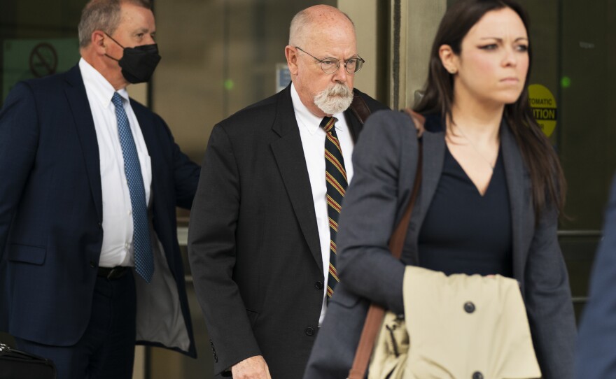 Special counsel John Durham, center, the prosecutor appointed to investigate potential government wrongdoing in the early days of the Trump-Russia probe, leaves federal courthouse in Washington, Monday, May 16, 2022.