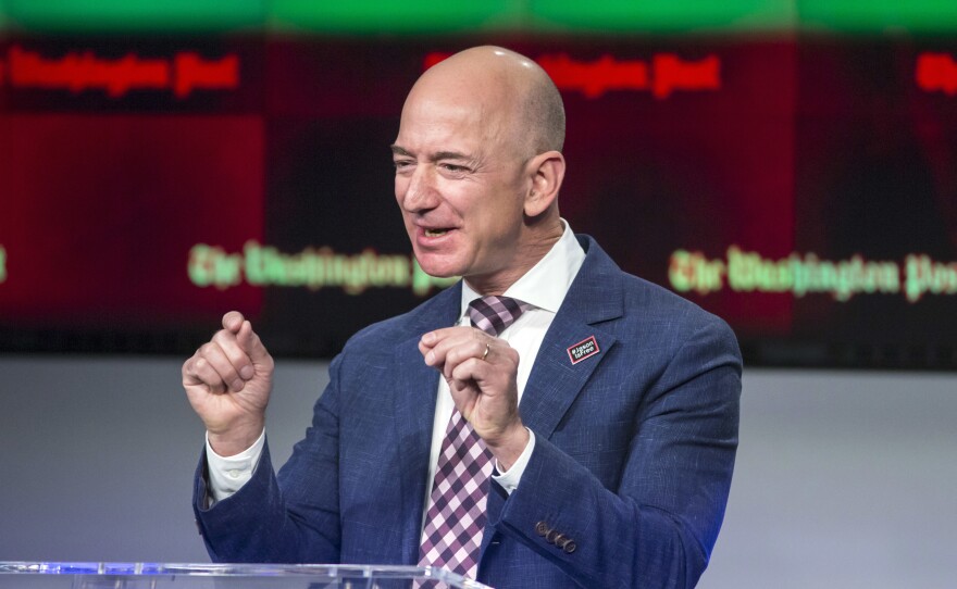 Billionaire Amazon founder and Washington Post owner Jeff Bezos talks during a dedication ceremony for newspaper's new headquarters in Washington in 2016.