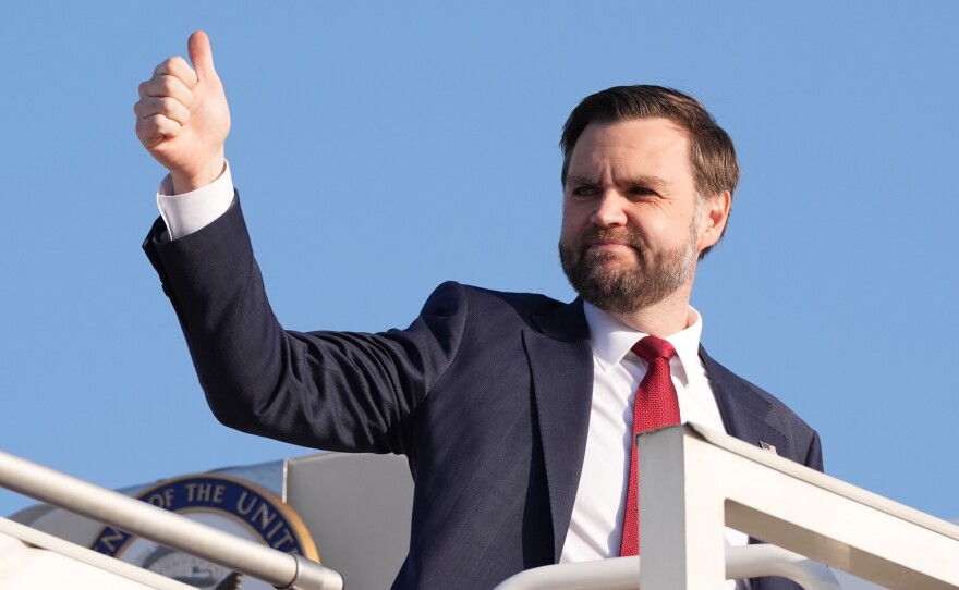 Vice President JD Vance gives a thumb up sign as he boards Air Force Two after attending talks on Iran in Islamabad, Pakistan, Sunday, April 12, 2026.