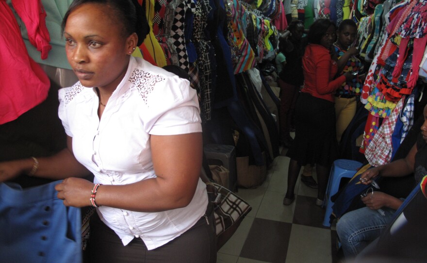 Marianne Njambi looks out at the bus station where a public stripping two weeks ago has inspired copycat attacks. "Since they started stripping girls," she says, "I started fearing."